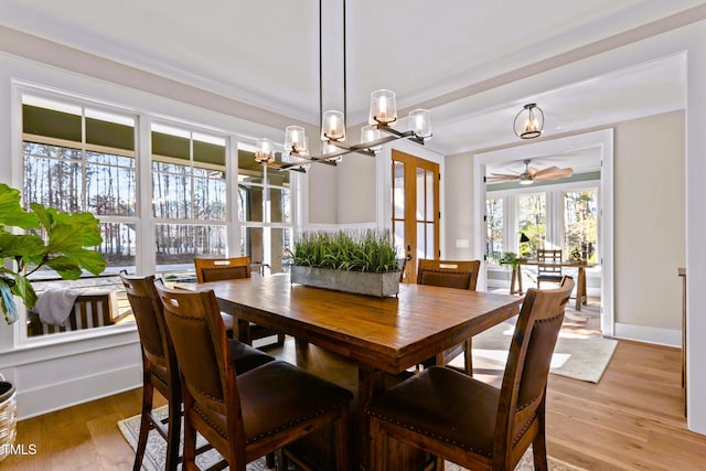 145 Wiggins Rd, Louisburg, NC 27549 - dining room with a chandelier, ceiling fan, and light wood-type flooring