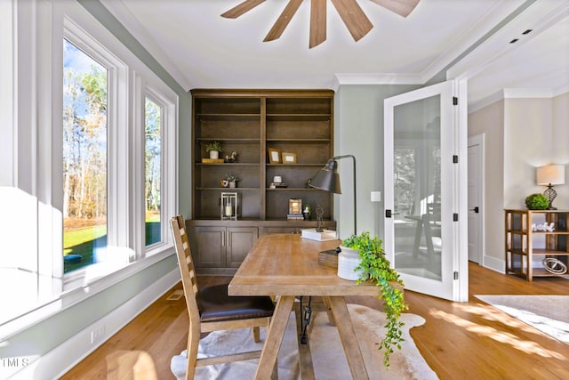 office with wood-type flooring and ornamental molding