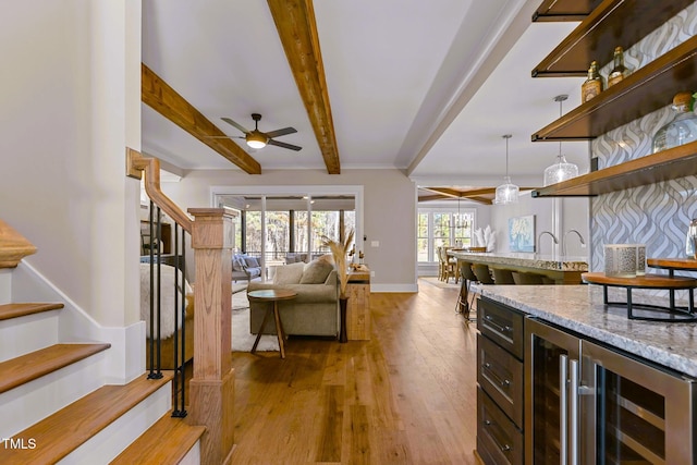 145 Wiggins Rd, Louisburg, NC 27549 - kitchen featuring beverage cooler, open floor plan, wood finished floors, beamed ceiling, and ceiling fan