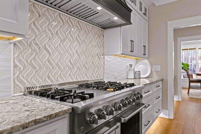 145 Wiggins Rd, Louisburg, NC 27549 - kitchen featuring double oven range, custom range hood, glass insert cabinets, light stone counters, and recessed lighting