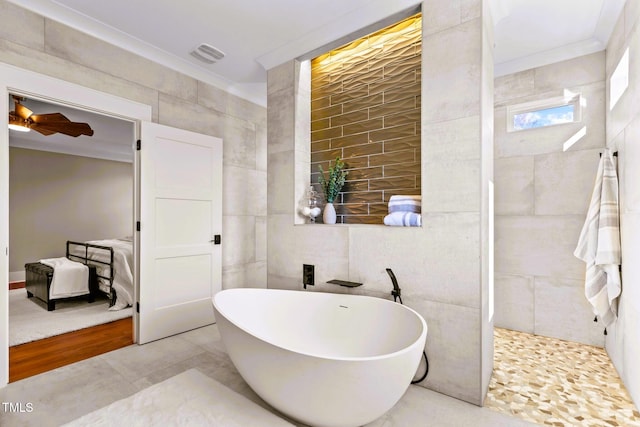 bathroom with a washtub, tile walls, crown molding, and ceiling fan