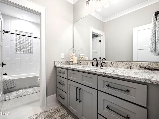 full bathroom featuring tile patterned floors, crown molding, shower / bath combination, toilet, and vanity