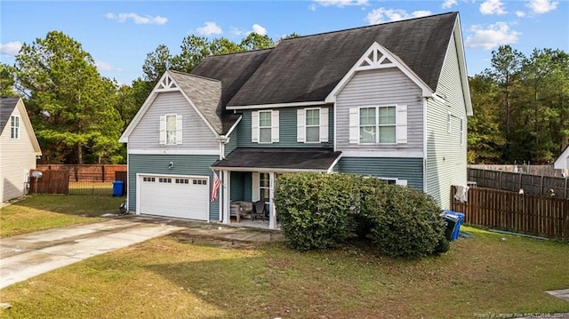 view of front of house featuring a garage and a front yard