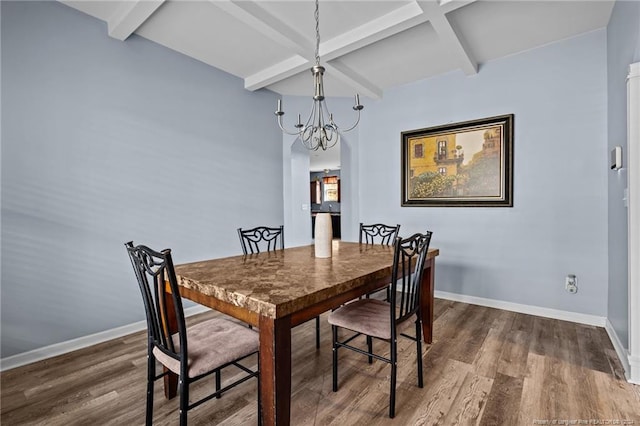 dining room featuring beamed ceiling, dark hardwood / wood-style flooring, and a notable chandelier