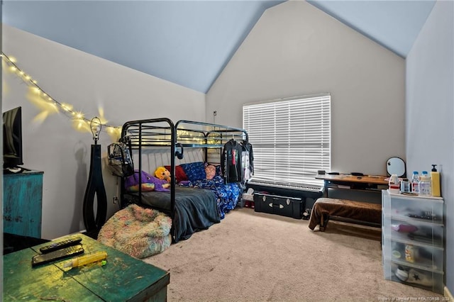 bedroom with carpet floors and lofted ceiling