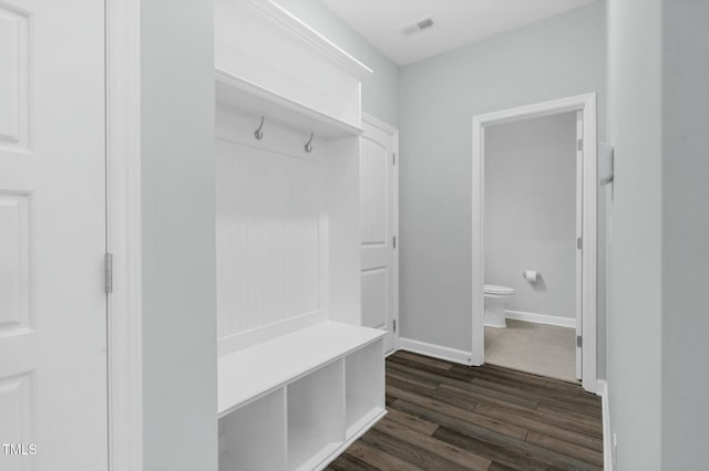 mudroom with dark hardwood / wood-style floors