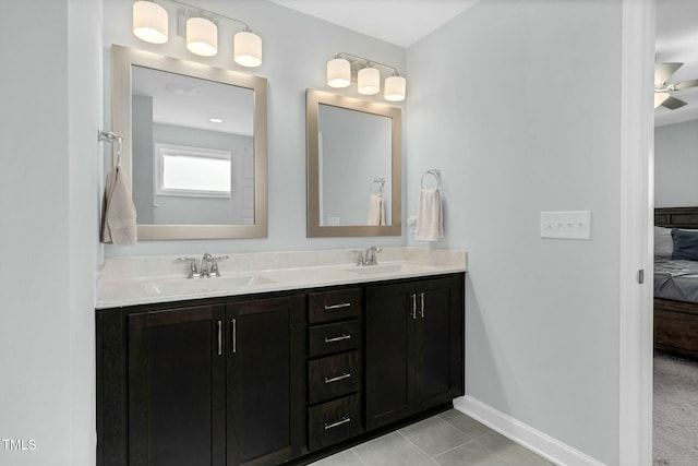 bathroom with tile patterned floors, ceiling fan, and vanity