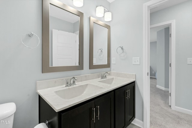 bathroom with vanity and toilet