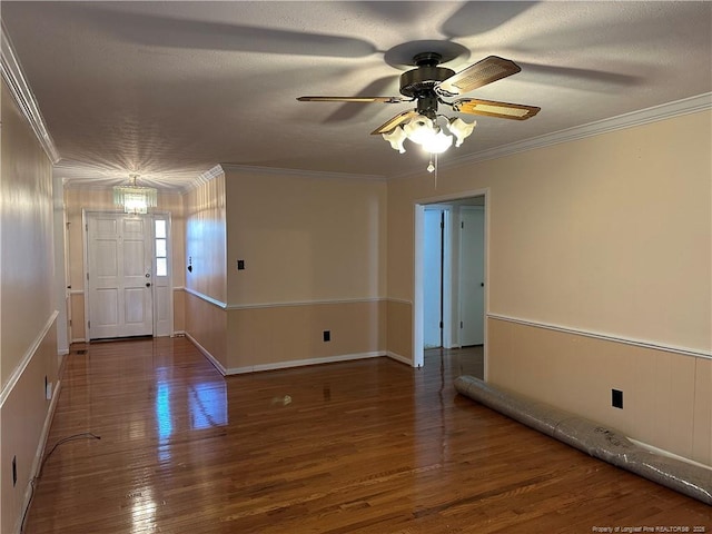 foyer featuring a textured ceiling, crown molding, and wood finished floors