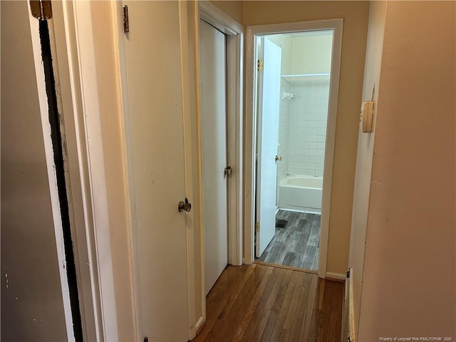 corridor featuring wood finished floors