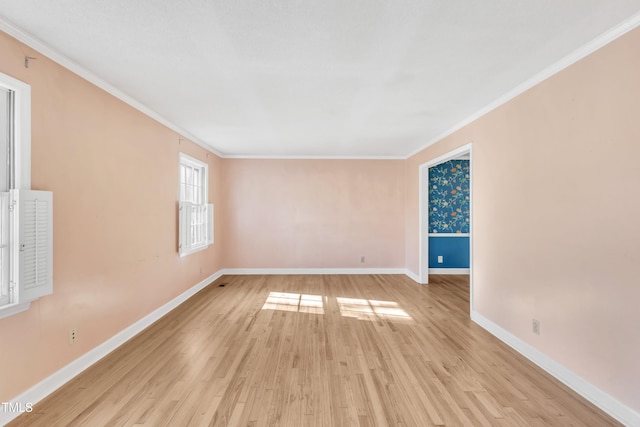 unfurnished room featuring crown molding and light hardwood / wood-style floors