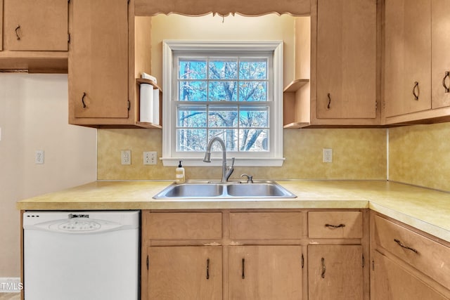 kitchen with decorative backsplash, sink, white dishwasher, and light brown cabinets