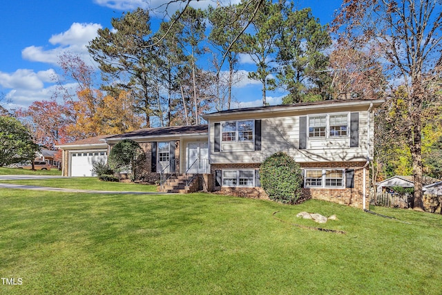 split level home featuring a garage and a front yard