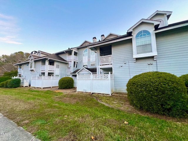 view of home's exterior featuring a yard