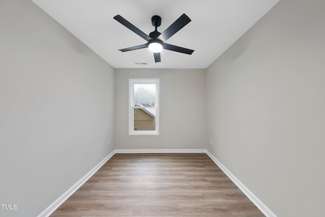 unfurnished room featuring ceiling fan and light wood-type flooring