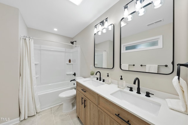 full bathroom with tile patterned flooring, shower / bath combo, vanity, and toilet