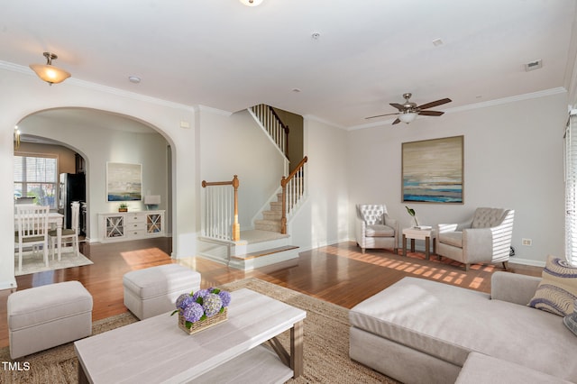 living room featuring hardwood / wood-style flooring and ornamental molding