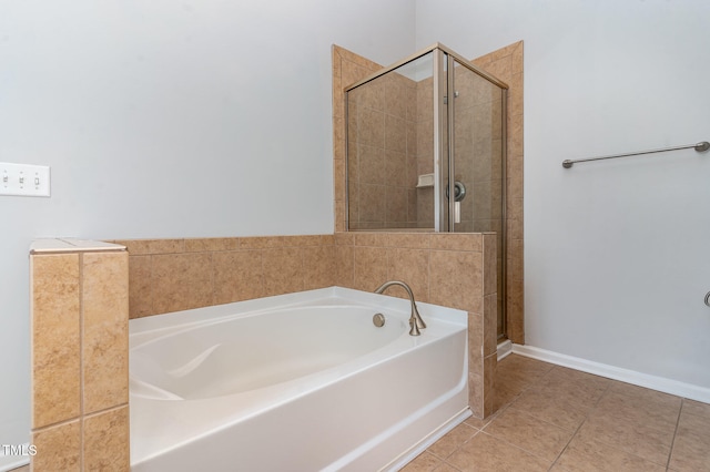 bathroom featuring tile patterned floors and shower with separate bathtub