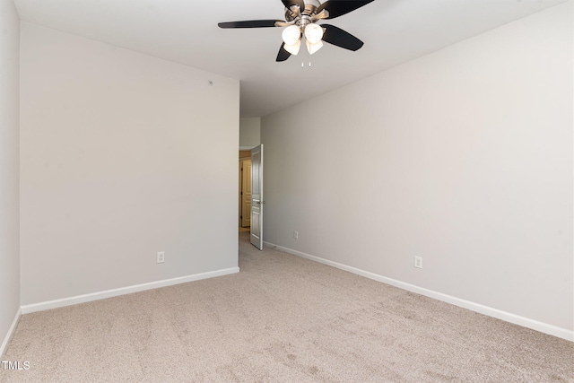 unfurnished room featuring ceiling fan and light colored carpet