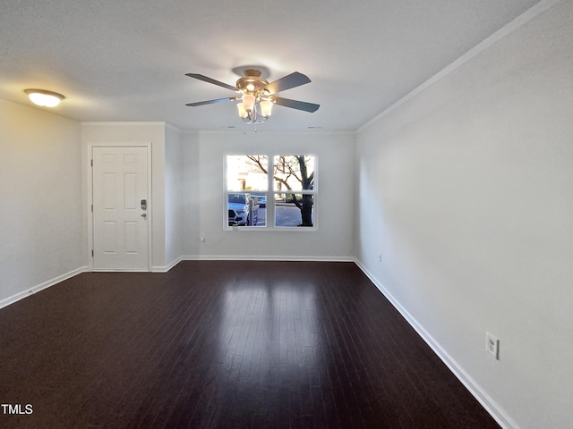 unfurnished room featuring dark hardwood / wood-style floors, ceiling fan, and ornamental molding