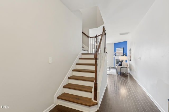 stairway with wood-type flooring