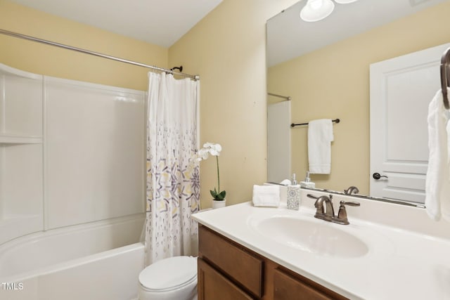 full bathroom featuring shower / tub combo with curtain, vanity, and toilet