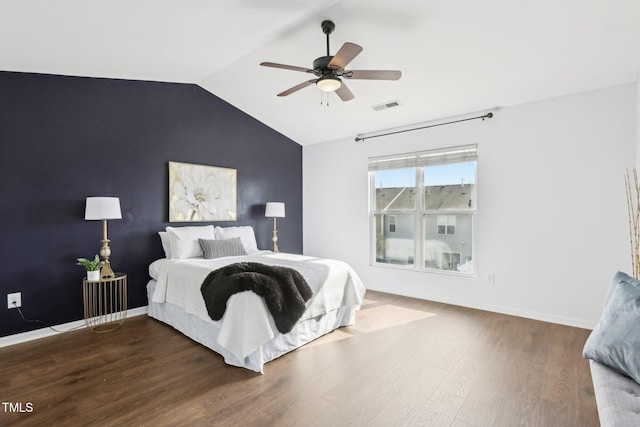 bedroom featuring vaulted ceiling, dark wood-type flooring, and ceiling fan