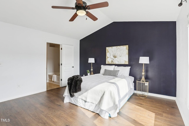 bedroom featuring ceiling fan, wood-type flooring, and vaulted ceiling