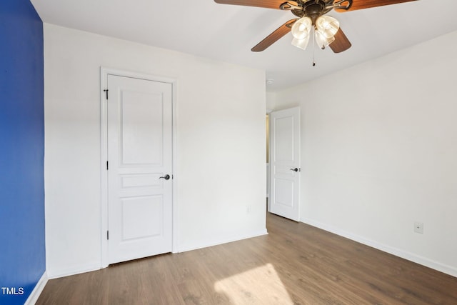 unfurnished bedroom featuring ceiling fan and light wood-type flooring