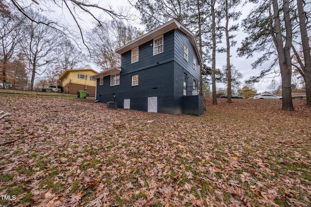 view of property exterior with central AC unit