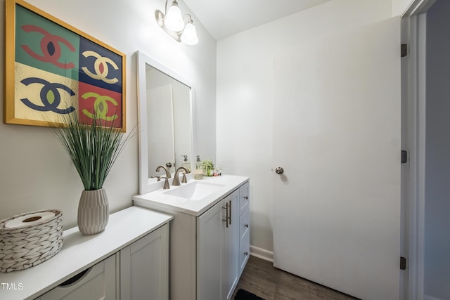 bathroom featuring hardwood / wood-style floors and vanity