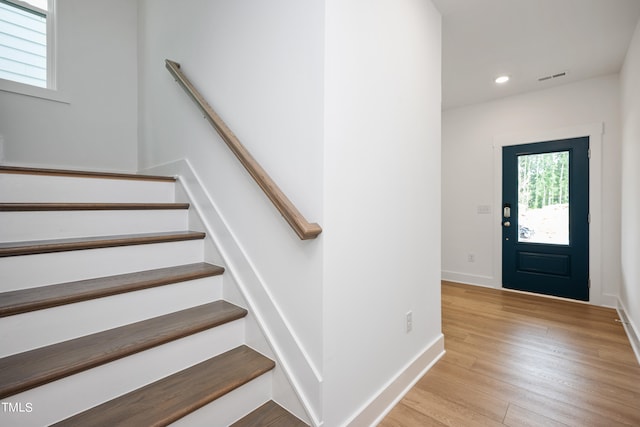 foyer entrance with light hardwood / wood-style flooring