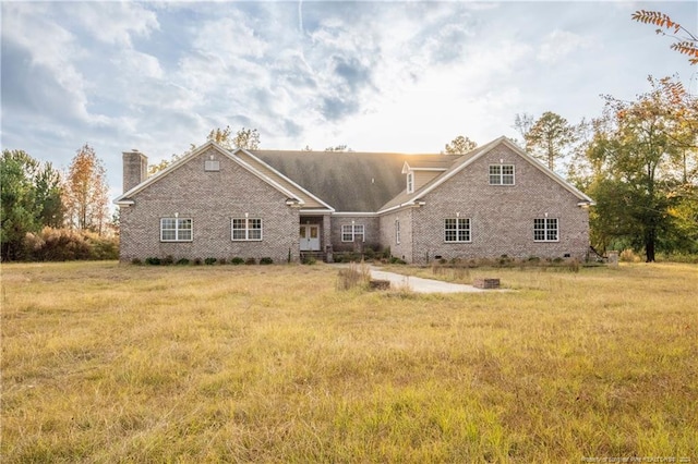 rear view of house with a lawn