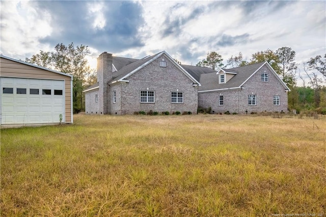 back of house with a garage