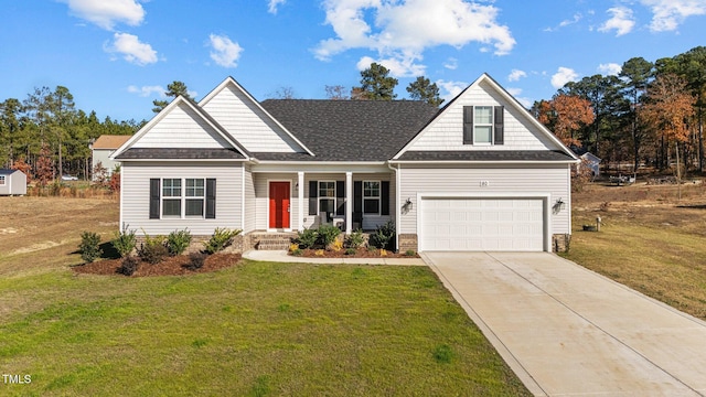 view of front of home featuring a garage and a front yard