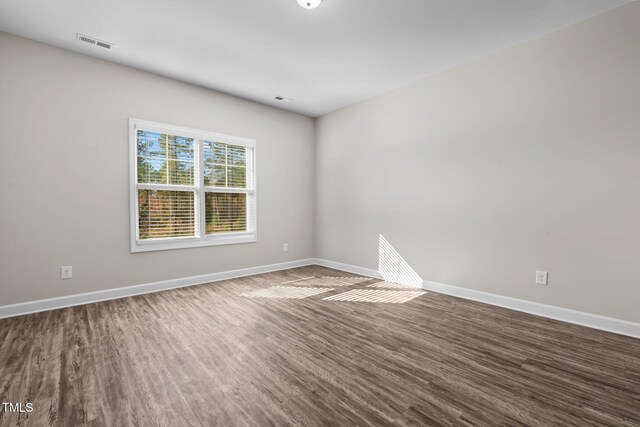 empty room featuring hardwood / wood-style flooring