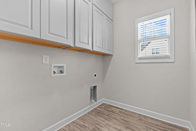 washroom with hookup for a washing machine, light hardwood / wood-style flooring, cabinets, and hookup for an electric dryer