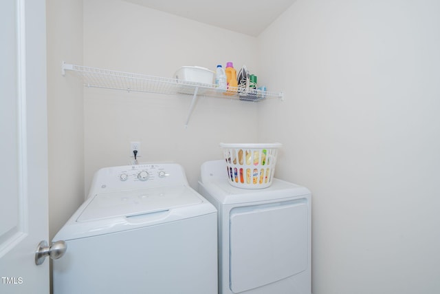 washroom with independent washer and dryer