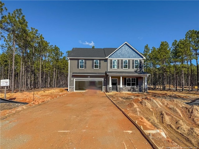 view of front of home with a garage and covered porch