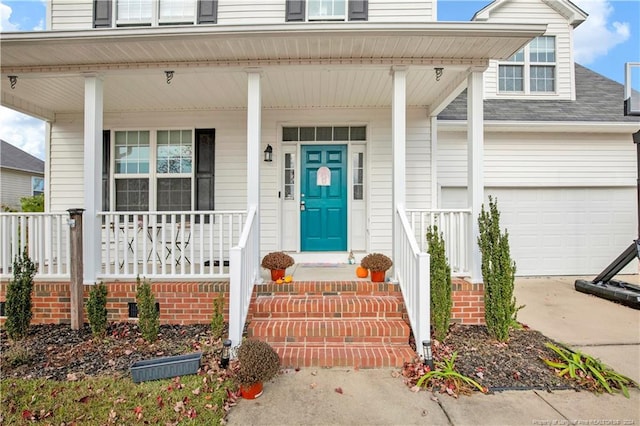 doorway to property with a garage