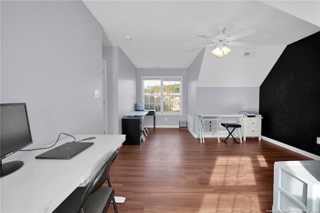 office space featuring dark hardwood / wood-style floors, vaulted ceiling, and ceiling fan