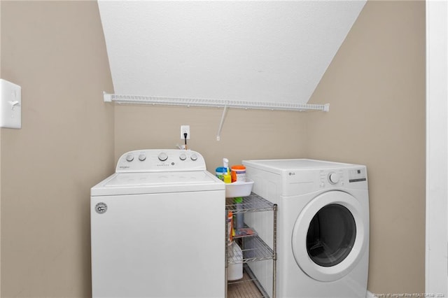 washroom featuring independent washer and dryer