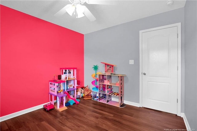 rec room featuring dark hardwood / wood-style floors and ceiling fan