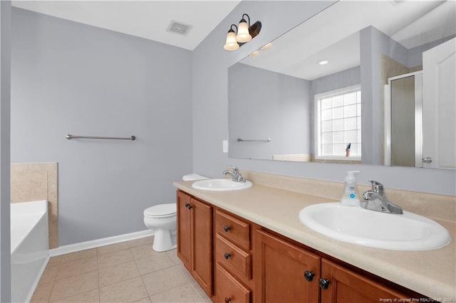 full bathroom featuring tile patterned flooring, vanity, separate shower and tub, and toilet