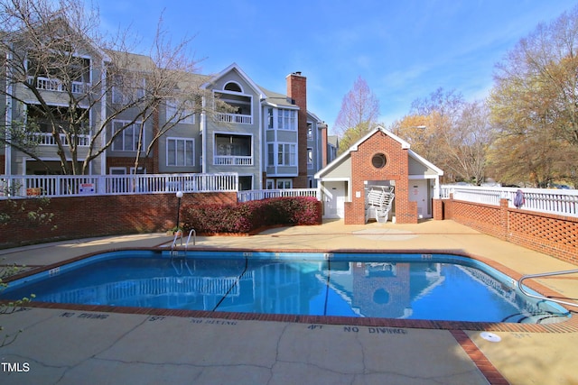 view of pool featuring an outdoor structure