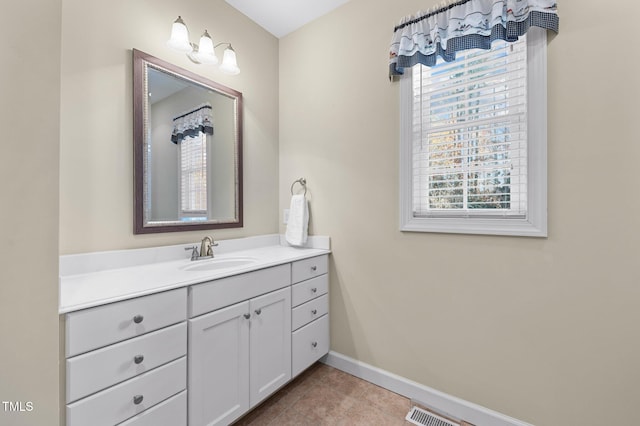 bathroom with vanity and tile patterned floors