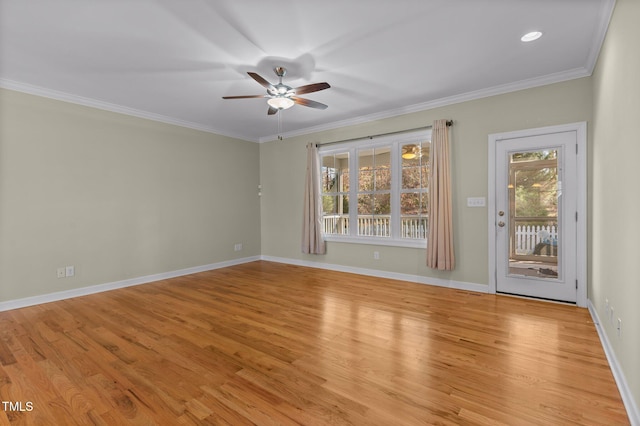 empty room featuring ceiling fan, light wood-type flooring, and ornamental molding