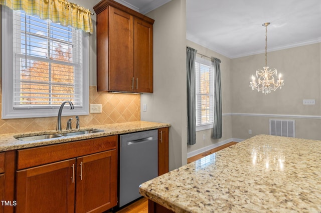 kitchen featuring stainless steel dishwasher, plenty of natural light, light stone countertops, and sink