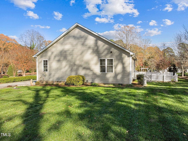 view of home's exterior with a lawn