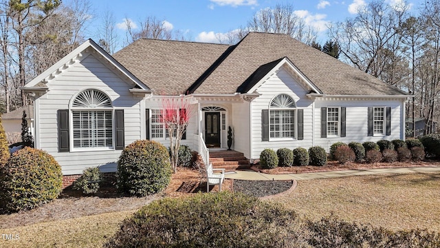 single story home featuring a front lawn